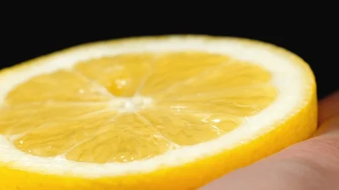 Slow Motion squeeze juice from lemon close up. Stock Footage 113265325
