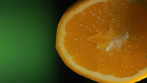 Slow Motion Squeeze Juice From Orange. vertical video Stock Footage 101821872