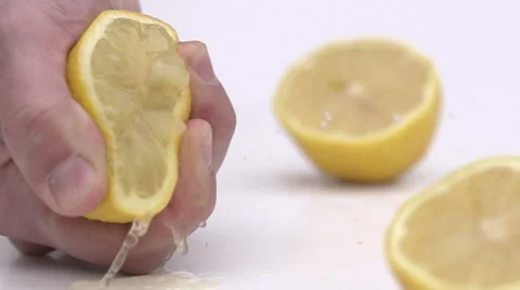 Slow motion squeezing lemon Stock Footage 33801760