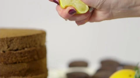 Slow motion squeezing lemon juice Stock Footage 70965083