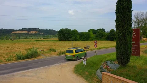 Slow motion stabilized shot - Famous cypress trees row along Tuscany road by POV Stock Footage 128757276