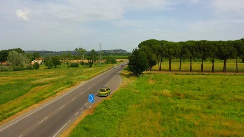 Slow motion stabilized shot - Famous cypress trees row along Tuscany road by POV Stock Footage 128757358