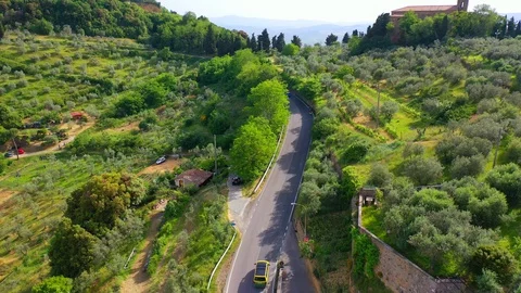 Slow motion stabilized shot - Famous cypress trees row along Tuscany road by POV Stock Footage 128758208