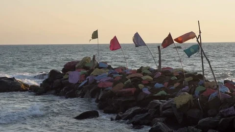 Slow motion static scene looking at colourful pile of painted rocks Stock Footage 107880123