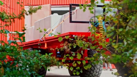 Slow motion static shot of red flatbed trailer loaded with concrete blocks Stock Footage 331931561