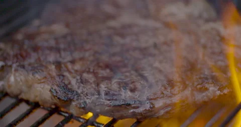 Slow Motion Steak Searing on Charcoal Grill Stock-Footage 141002306