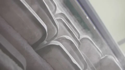 Slow motion: Steam from the freezer drips down the packages Vidéo 243310174