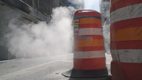 Slow motion steam rising from beneath the streets Stock Footage 316977650