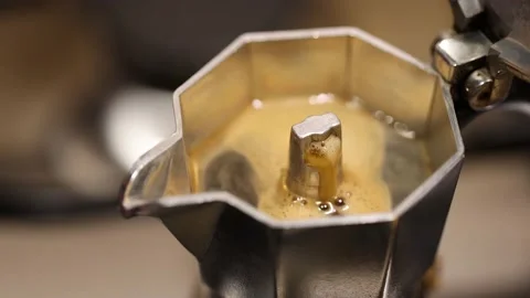 Slow motion steaming Moka Pot brewing coffee. Italian espresso maker Stock Footage 231707402