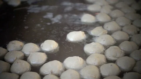 Slow motion of steaming over soup in a big pot with meatball cooking Stock Footage 74183198