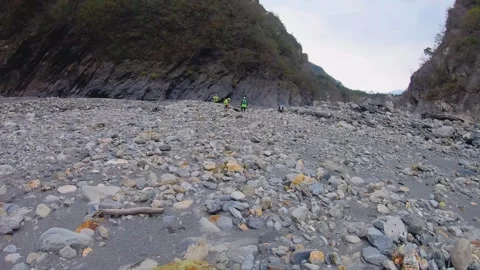 Slow motion still view of group of hikers wearing helmet and bright color outfit Stock Footage 265492652
