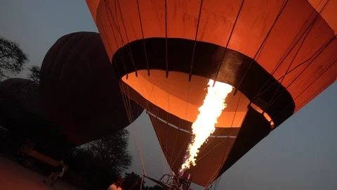 Slow Motion of sting flame - fire in a starting hot air Balloon early morning Stock Footage 79915478
