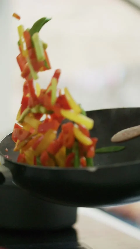 Slow Motion Stir Fry Vegetables Tossed in Wok – Vertical Cooking Food Video Stock Footage 328985166