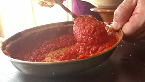 Slow motion Stirring Tomato Sauce for Spaghetti or Pizza in kitchen close up Stock Footage 277534664