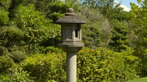 Slow Motion Stone Lantern in Lush Garden Vídeos de archivo 327567371