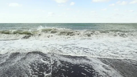 Slow motion the storm wave is swirling about the shore Stock Footage 82656023