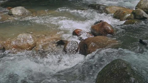 Slow motion stream and waterfall in the jungle. Rain forest in southeast Asia Stockbeeldmateriaal 232967029