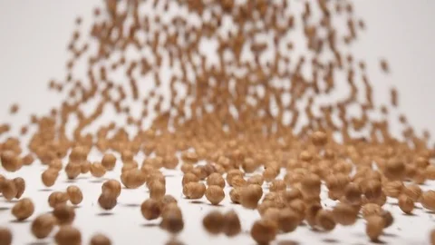 SLOW MOTION: Stream of chocolate balls rolls to a camera Stock Footage 70798463