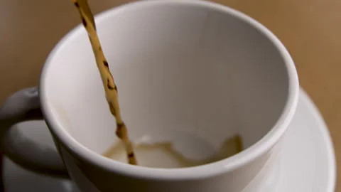 Slow Motion of a Stream of Coffee Pouring Into an Empty Mug Stock Footage 270386259