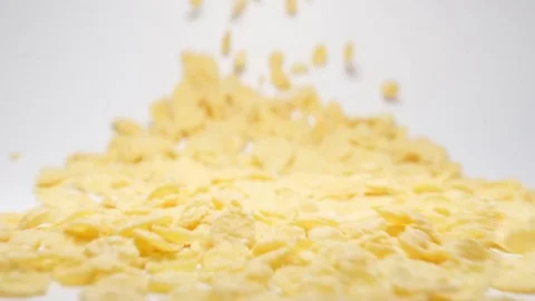 SLOW MOTION: Stream of  corn flakes moving to a camera Stock Footage 70572531