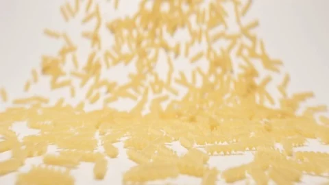 SLOW MOTION: Stream of fusilli pasta moving to a camera Stock-Footage 70572898