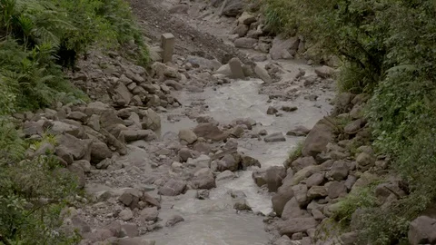 Slow motion stream running down the mountain Stock Footage 69772634