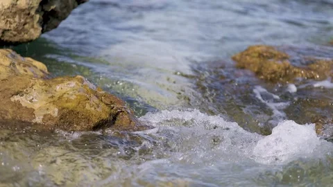 Slow Motion Stream of Water Flowing Over Rocks. Close-Up Water Stream on Co.. Stock Footage 307700822