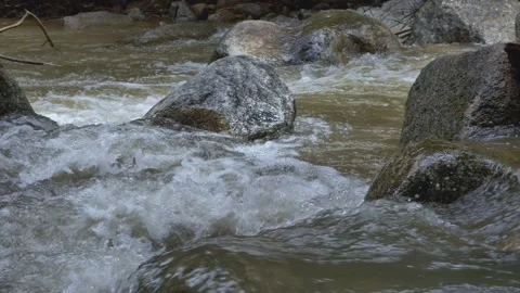 Slow motion streama and waterfall in southeast Asia. Rain forest in Thailand Stockbeeldmateriaal 232967008