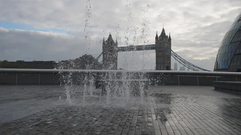 Slow Motion. Streams of water pushing up in front of the Tower Bridge. Stock Footage 143223467