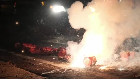 Slow Motion Street Firework Explosion at Night – Sparks, Smoke, and Festival Stock Footage 321599978