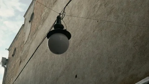 Slow motion: Street lighting with a wall background. 4k Stock Footage 103284211