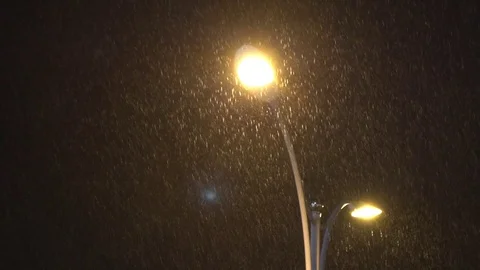 Slow motion Streetlight while it rains in the night of City. Raining street -Dan Stock Footage 78253974