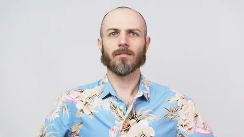 Slow motion strict man wearing hawaiian shirt raising finger in warning gesture Stock Footage 126701522