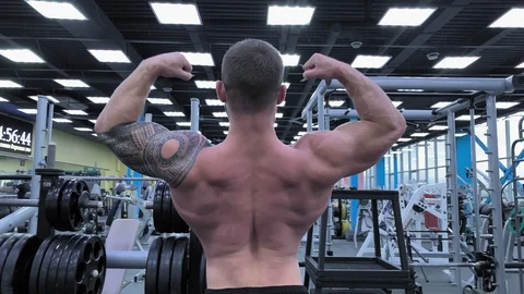 Slow motion. Strong man bodybuilder. Male bodybuilder. Young brutal male body Stock-Footage 117938378
