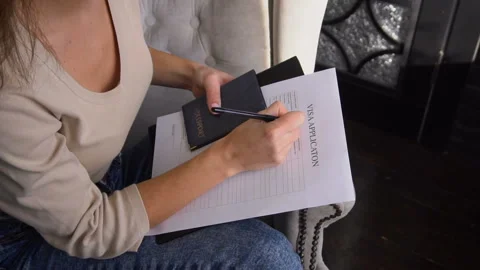 Slow motion student female preparing documents for getting visa to study abroad. Stock Footage 88609345