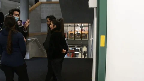 Slow motion, Students in library university in London talking with face mask Video stock 126299335