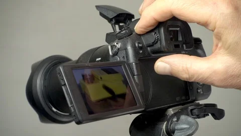 Slow motion: Studio flash photograph being taken. Video stock 96691163