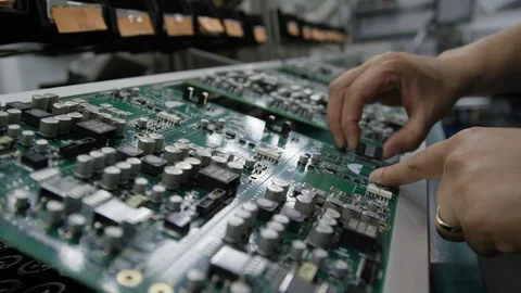 Slow motion stuffing circuit boards electronics factory Stock Footage 92713831