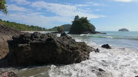Slow motion of stunning Beach with rocks in the ocean Stock Footage 302692150