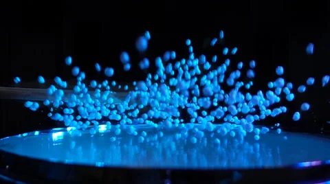 Slow motion styrofoam balls against black background Stock Footage 59149378