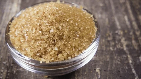 Slow motion sugar cube falls into a bowl of sugar close up Stock Footage 95785424