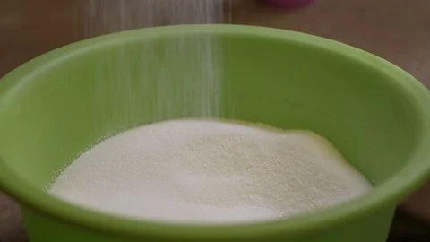 Slow motion of a sugar falling down Stock Footage 75059952