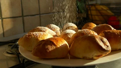 Slow Motion of Sugar Falling on Fresh Baked Pastry Stock Footage 325518839