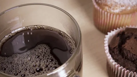 Slow motion sugar is poured into a cup of coffee on the table Stock Footage 88822543