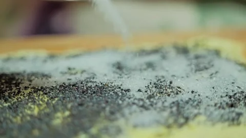 Slow Motion Sugar Sprinkled over Poppy Seed Puff Pastry Before Baking Cookies Stock Footage 340334705