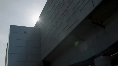 Slow motion sun and lens flare over building Stock-Footage 128775142
