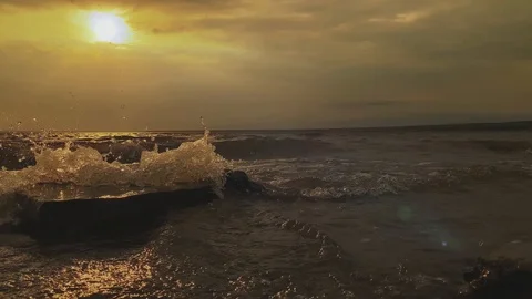 SLOW MOTION. Sun rays emerging through clouds in the middle of the rough exotic  Stock Footage 117273639