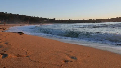 Slow Motion of Sun Sets Over the Ocean and Waves Crashing on the Sand - Carmel, Stock Footage 114137098