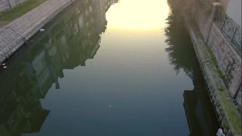 Slow motion of sunrise and reflection on the canal in the city. Stock Footage 148517181