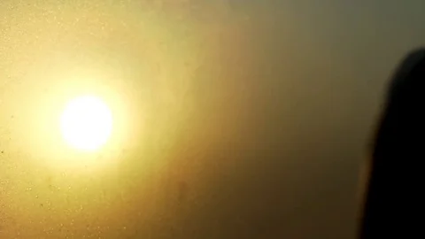 Slow Motion Sunrise Flickering Through Trees And Chair From Frosted Bus Window. 스톡 동영상 84760832